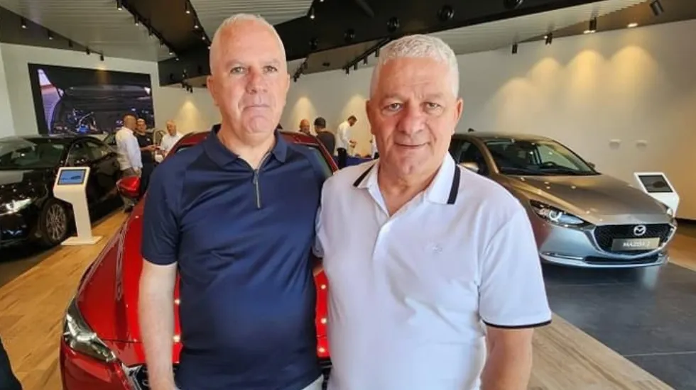 פיני (מימין) ושמעון סבח, בעלי קבוצת מילניום 